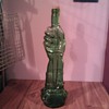 Hand/Dagger Green Glass Bottle