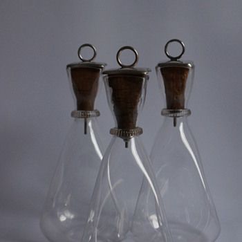 Three Silver Topped Carafes