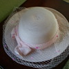 Pink women's hat with pink ribbon hat band and veil