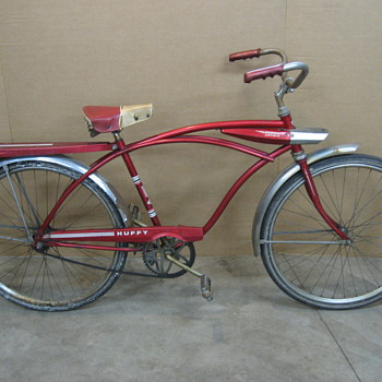 Huffy Camaro tank bicycle with light.