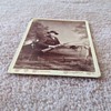 Cabinet card of Duck Hunter in a boat with his dog