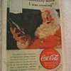1940 ADVERTISING SANTA CLAUS DRINKING A BOTTLE OF COKE.
