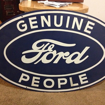 vintage "Genuine Ford People" steel sign