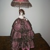 Doll with light in parasol