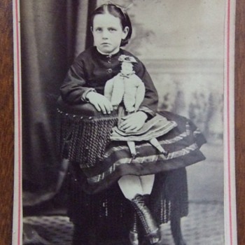 Enameled CDV of girl with a doll