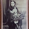 Enameled CDV of girl with a doll