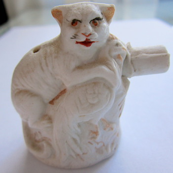 What is this cat with chicken porcelain "thing"?