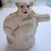 What is this cat with chicken porcelain "thing"?