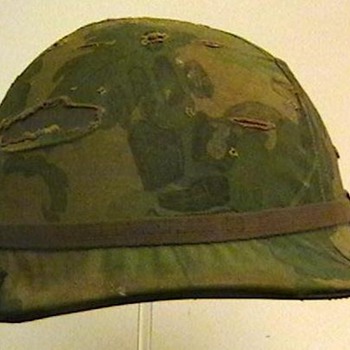 U.S. Army M-1 Helmet with Cover and Two NVA Flags