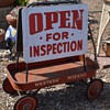 Old Sandwichboard - OPEN FOR INSPECTION and a Western Wizard Red Wagon