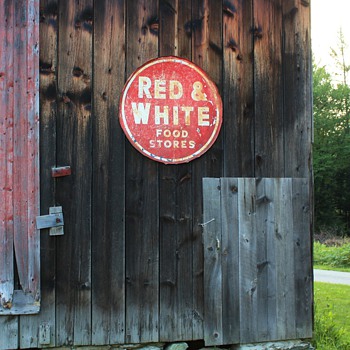 Some old signs my sister has collected and hung on her barns and an urn in a family neighbor's garden