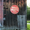 Some old signs my sister has collected and hung on her barns and an urn in a family neighbor's garden