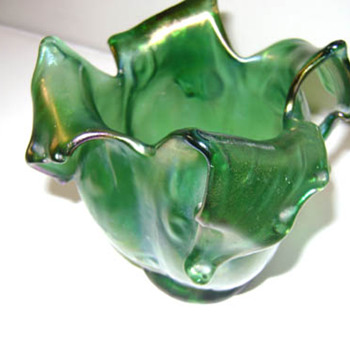 found this in a thrift store here in nyc. Does anyone know who the maker is? It is an irridecent green/purple. Any idea? 