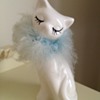 Fur trimmed cat figurine