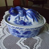 BLUE AND WHITE BOWL WITH FISH ON COVER.