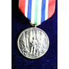 Alaska Territorial Guard 1942-1947 Medal and Ribbons in display case.
