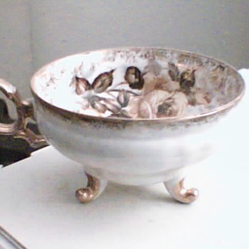 very old footed tea cup and saucer unmarked - Glassware