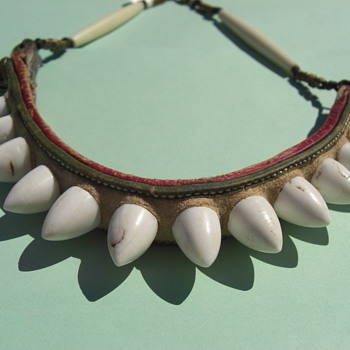 Bone or tooth item made into a necklace - Folk Art