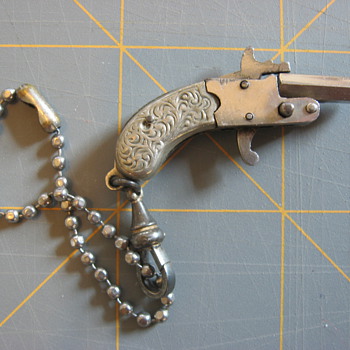 Tiny made in Austria miniature pin-cap gun - Toys