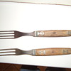 Old forks with wood handles.