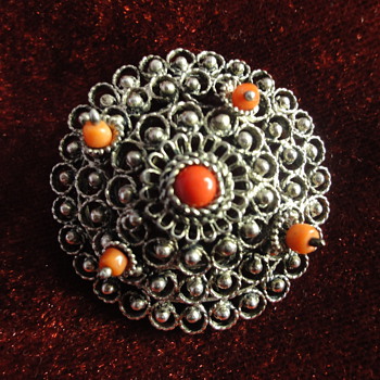 Silver, coral peasant brooch. 