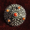 Silver, coral peasant brooch. 