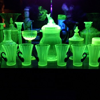 Our family room Gustav Stickly desk w/Pretty Vaseline & Green things & my night stand - Art Glass