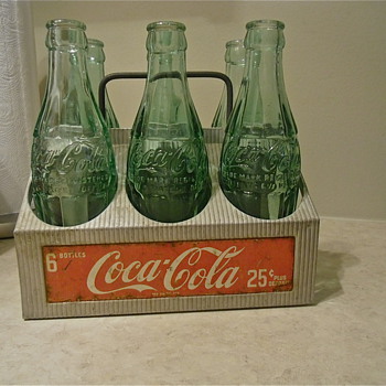 6 50s or .25 coca cola bottles in their carrier