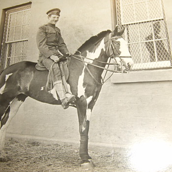 RPPC of early 20th century soldier on horseback - Photographs