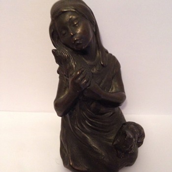 Girl hugging her little kitten figurine - Figurines