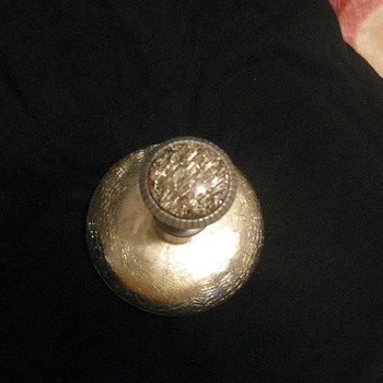 Thought it was a door knob as it was in a box with old door knobs until I took a second look. Its a perfume decantor. - Bottles