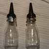 vintage oil bottles with spouts and tags