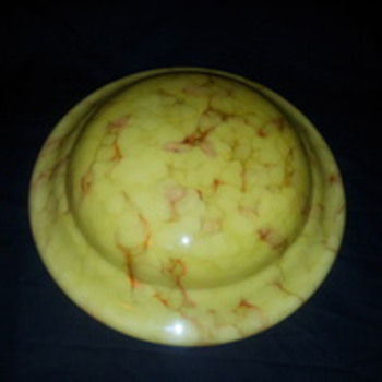 Honey coloured u.f.o. shaped hanging shade marbled with orange/brown.