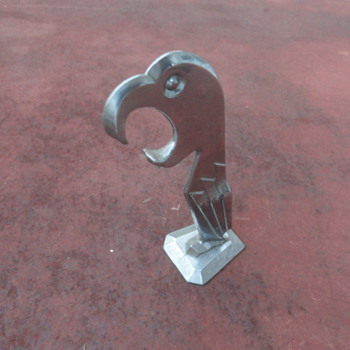 Not sure what this is, I'm guessing that it's some kind of bottle opener - Breweriana