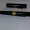 IN A CIGAR BOX OF PENS