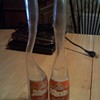   Two  funny looking Moxie soda bottles