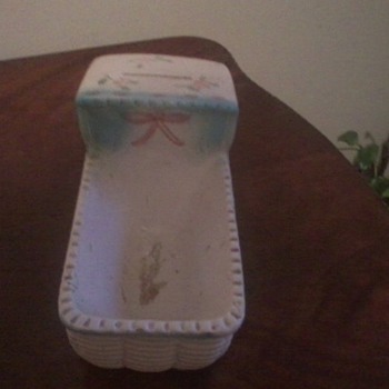 Bassinette porcelain bank-planter?