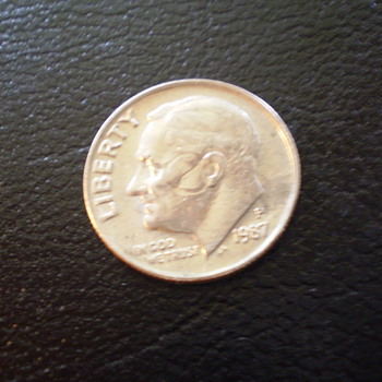 1987P  with circle on cheek, and effects the ear
