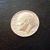 1987P  with circle on cheek, and effects the ear