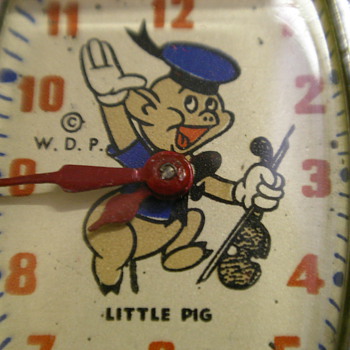 1947 Little Pig (with fiddle) by Ingersoll/US Time - Wristwatches