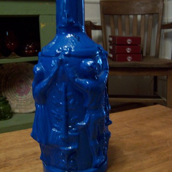Blue bottle jar with ladies and men dancing
