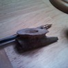very old pipe and grinding stone