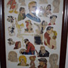 Framed comic and cartoon art.