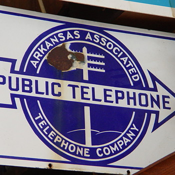 2 Different Arkansas Associated Telephone company signs - Telephones