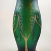 Emerald green gilt vase with cartouche indents, ca. 1900