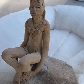 Girl on a rock - Art Pottery