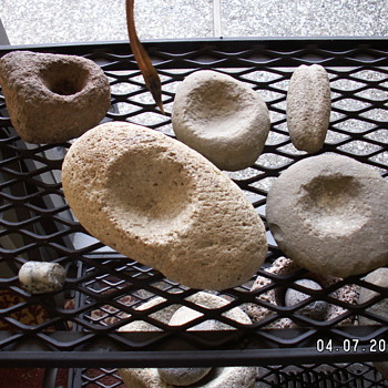  Flipping over morters & pestles - Native American
