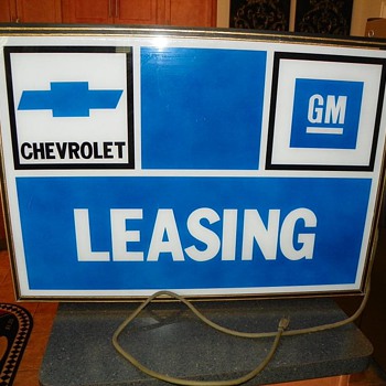 Old Chevrolet GM leasing dealership sign