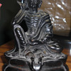 A runway models starving Buddha