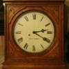 19th c. Seth Thomas wood carved wall clock with custom key entry. 